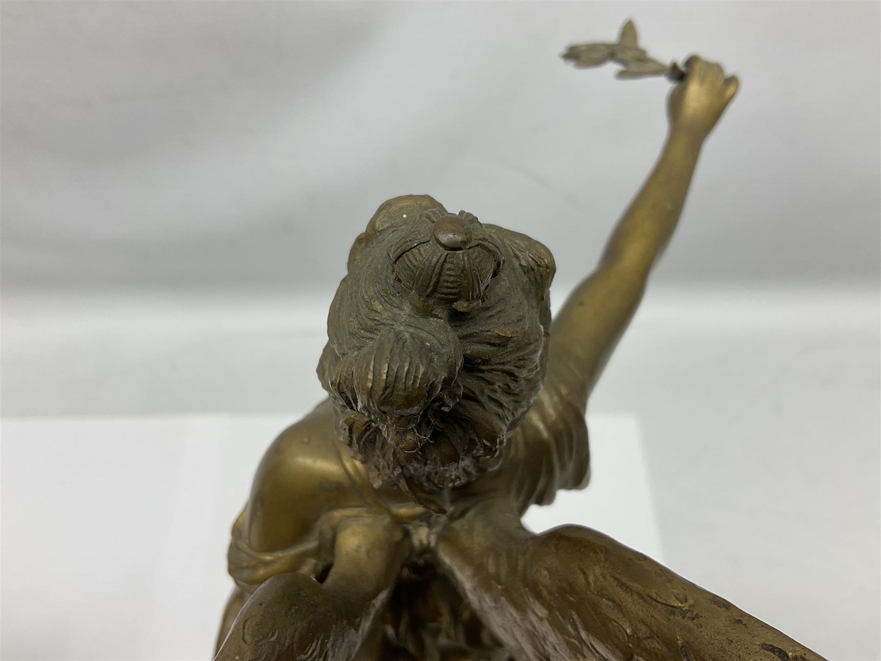 After Oswald Schimmelpfennig (German, 1872-1939): Pair of gilt bronze winged Allegorical female figures, the first example with arm outstretched holding a branch, signed 'Schimmelpfennig 1900', the second with arm raised above her head holding a book and sword in the other, both raised upon marble plinths, H45cm