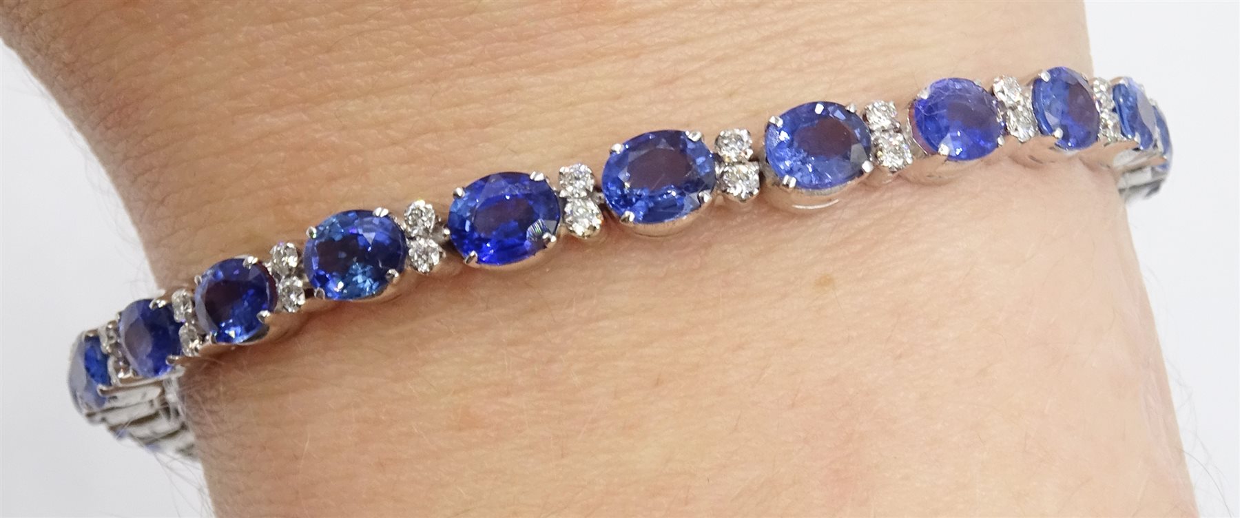 18ct white gold oval sapphire and diamond bracelet, stamped 750, total sapphire weight approx 12.00 carat