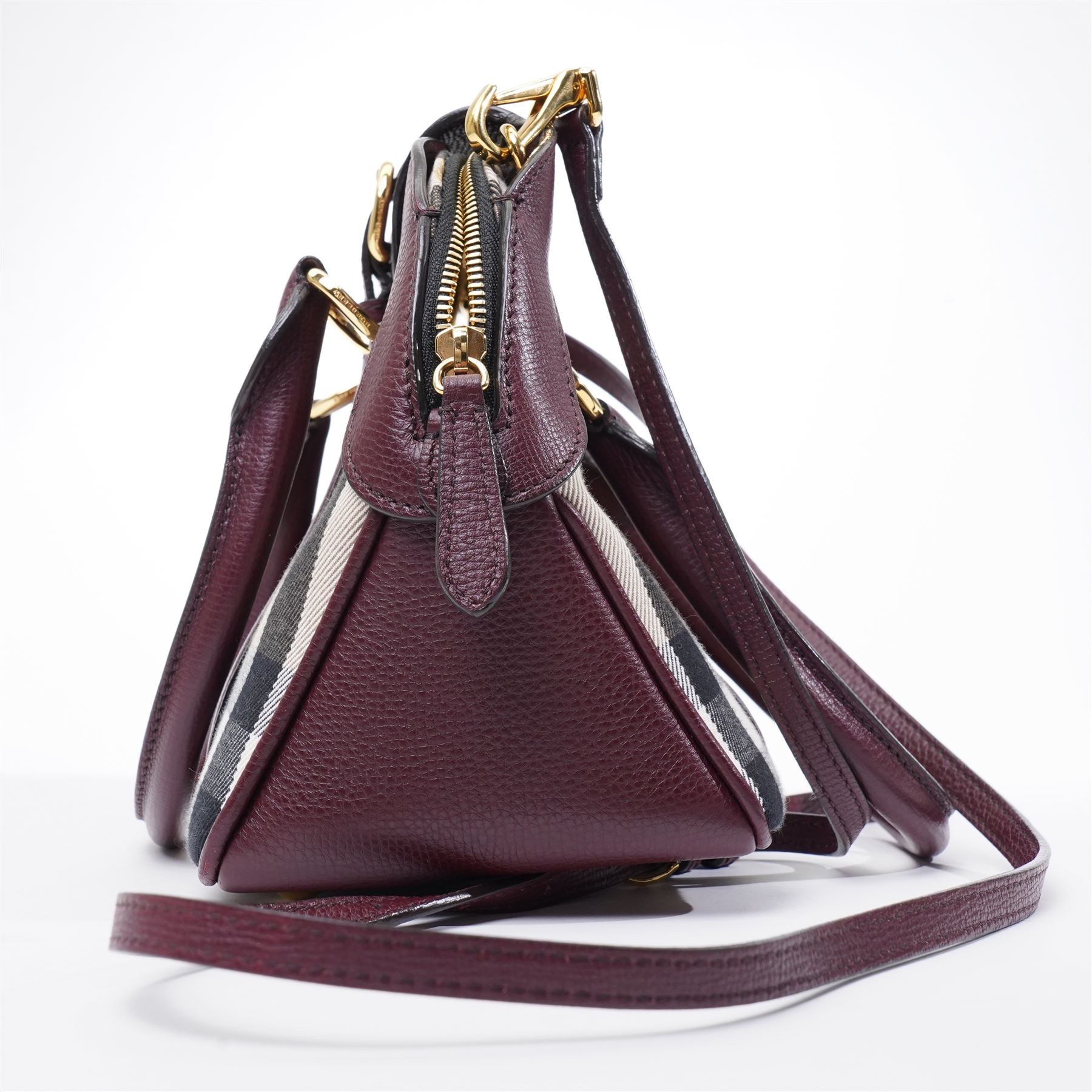 Burberry - ‘Milverton’ Small House Check Bag, introduced circa 2015 under Christopher Bailey, in signature Haymarket check canvas with oxblood grained leather trim and belted front detail, with rolled top handles and detachable shoulder or crossbody strap, with gold-tone hardware, unused with original dust bag