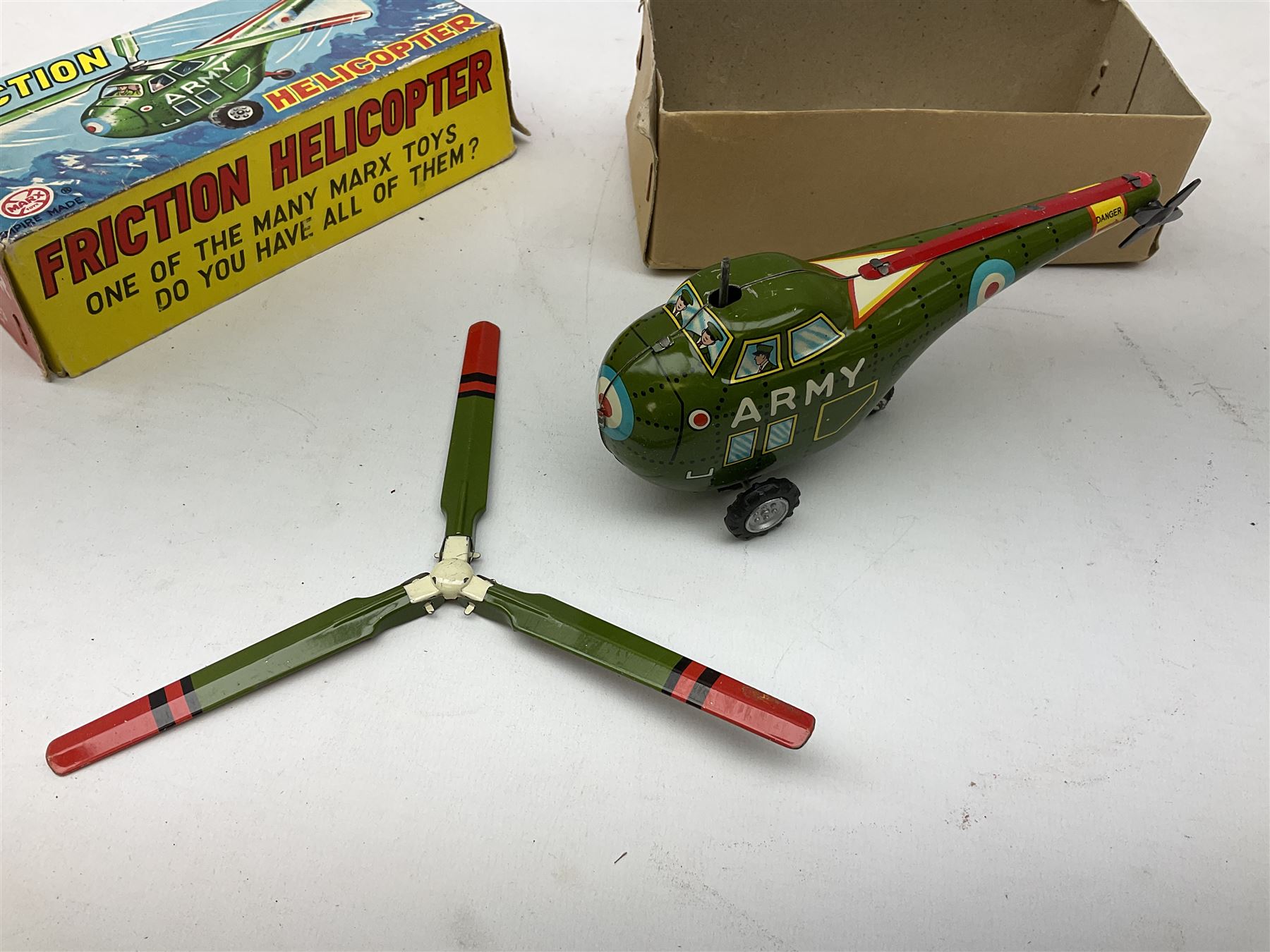 Various makers - Tri-ang Mini-Hi-Way Racing Car Series Le Mans No.9 racing car; Matchbox K-15 Merryweather Fire-Engine; Marx tin-plate Friction Helicopter; all boxed; and a Minic Motor Rally Adventure box containing a Jaguar Police car for spares or repair (4)