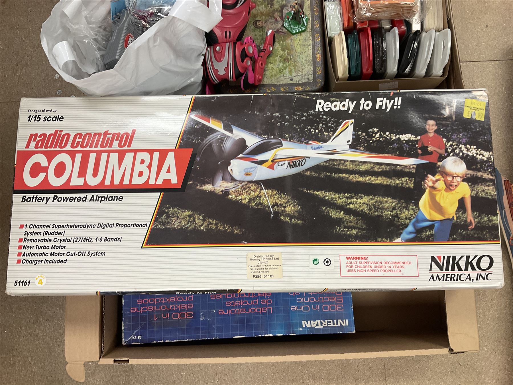 Large quantity of modern toys to include Matchbox Chopper Chase, Nikko battery control airplane, small amounts of K’nex, Meccano, playing cards to include Yu-Gi-Oh cards, keyrings etc in three boxes 