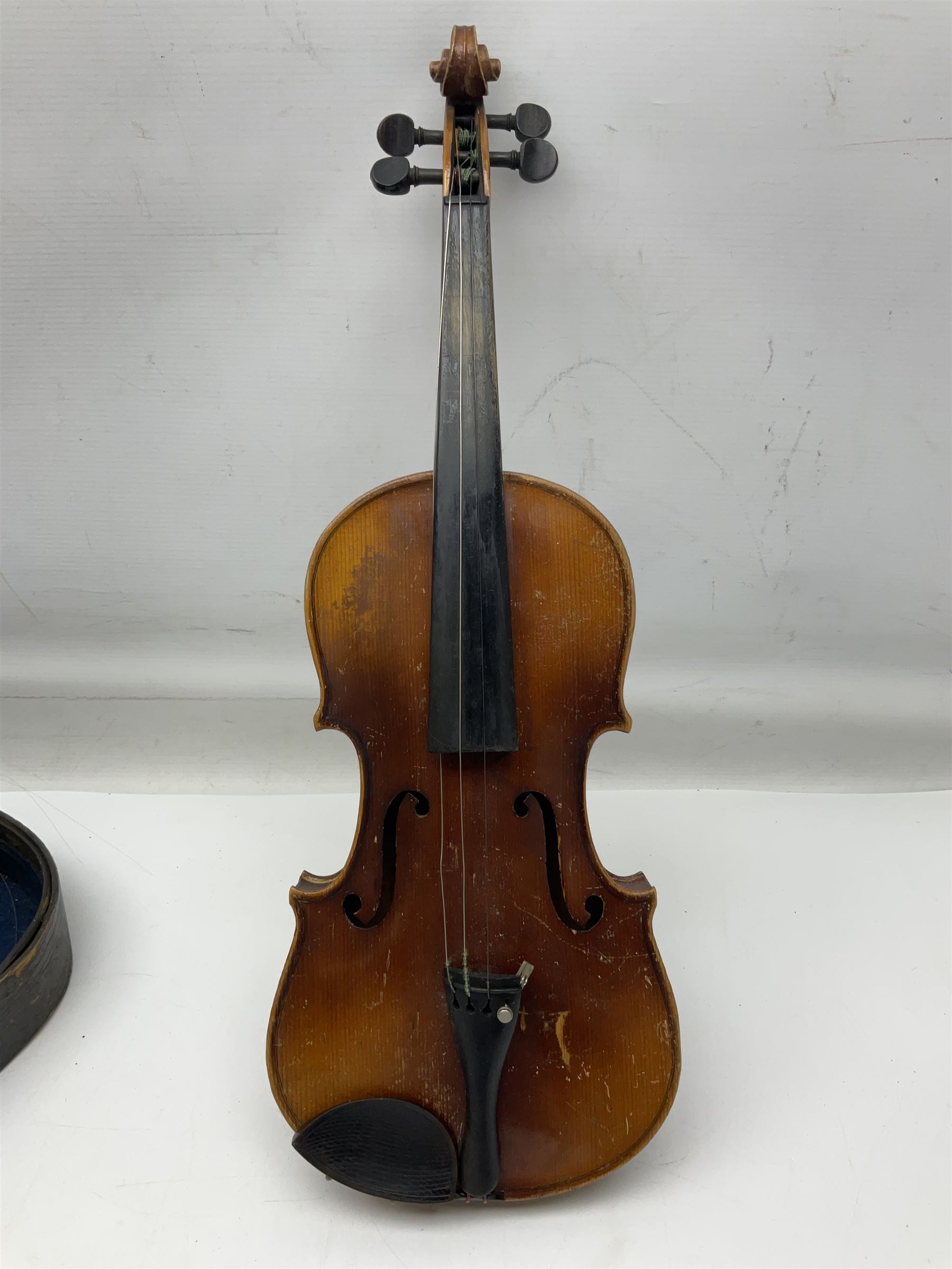 Czechoslovakian violin c1920 with 36cm two-piece maple back and ribs and spruce top, bears label 'Copy of Antonius Stradivarius Made in Czechoslovakia' L59cm; in carrying case; 1950s Czechoslovakian violin; and 195os Czechoslovakian three-quarter size violin; both cased (3)