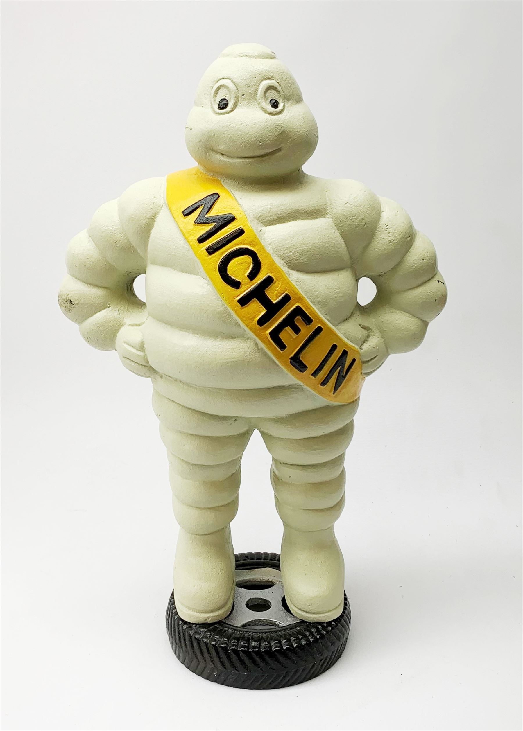 A cast iron Michelin man type figure, H40cm.