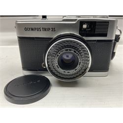 Four Olympus camera bodies, including Olympus OM10, serial no 20744269, with 'Olympus OM-System Zuiko Auto-S 50mm 1:1.8' lens serial no 3633644, Olympus OM-2 camera body serial no 460280 with 'Olympus OM-System G.Zuiko Auto-s 1:1.4 f=50mm' lens, serial no 729750, etc 