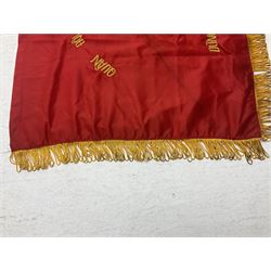 1960s North Vietnam banner embroidered in yellow thread on a red ground, roughly translates as 'Peoples Army of Viet Nam. Warriors of Viet Nam Determined To Keep The Country 1964' around a central military crest with the motto 'Warriors Keep The Country'; tassels to three sides 70 x 100cm