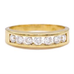 18ct gold diamond ring, channel set with seven round brilliant cut diamonds, hallmarked, t...