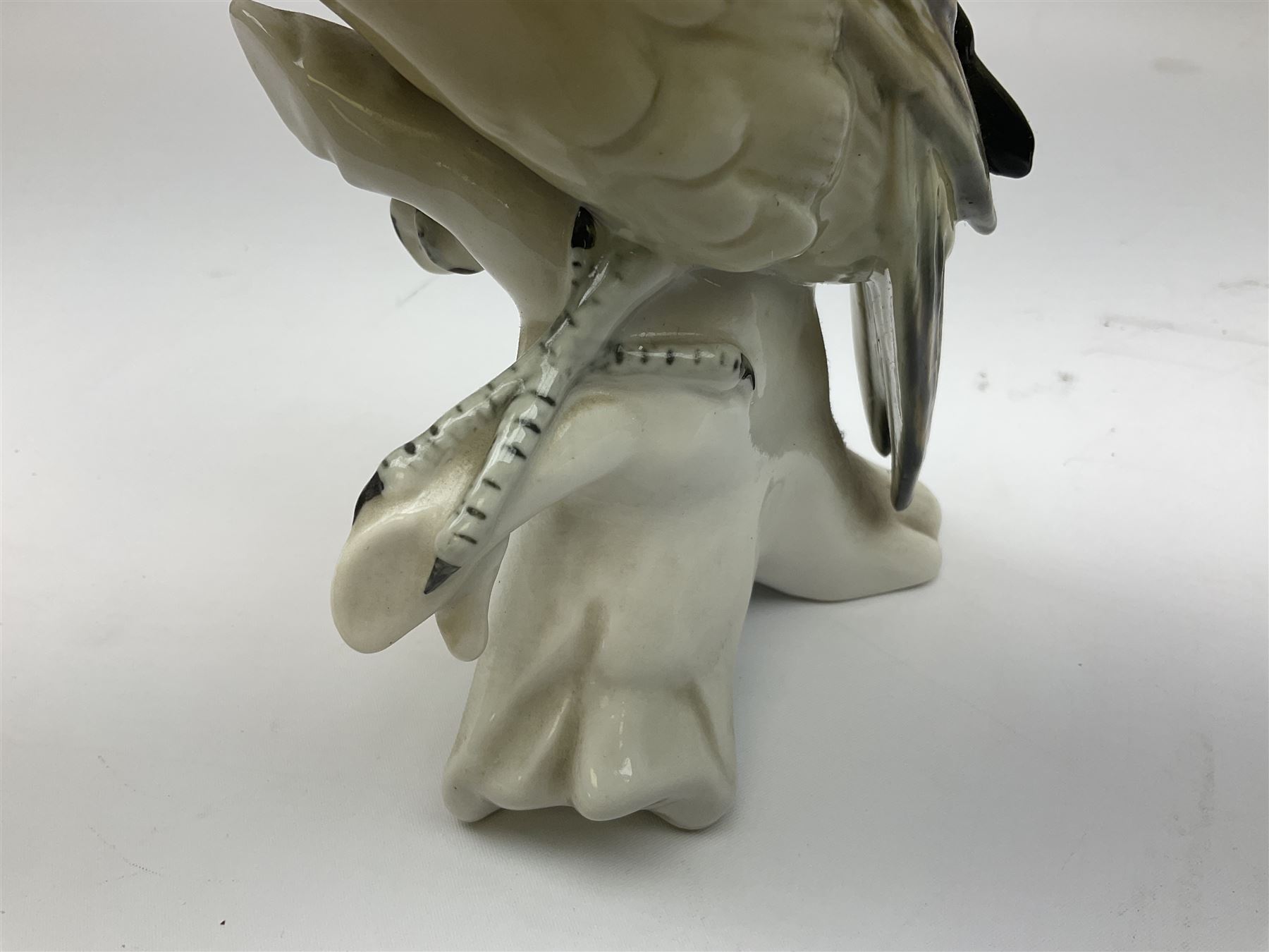 Karl Ens figure of a green woodpecker, modelled perched upon branch, model no. 7527, together with Karl Ens figure of budgie and Beswick Kingfisher no. 2371, all with printed marks beneath, tallest H25cm