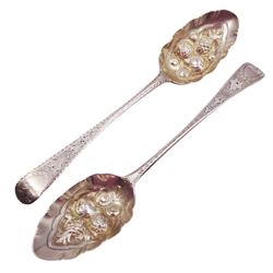 George IV silver fruit serving spoon, the bowl embossed with fruits, with engraved vine leaf decoration to handle, hallmarked London 1789, together with a very similar earlier example, hallmarks worn and indistinct