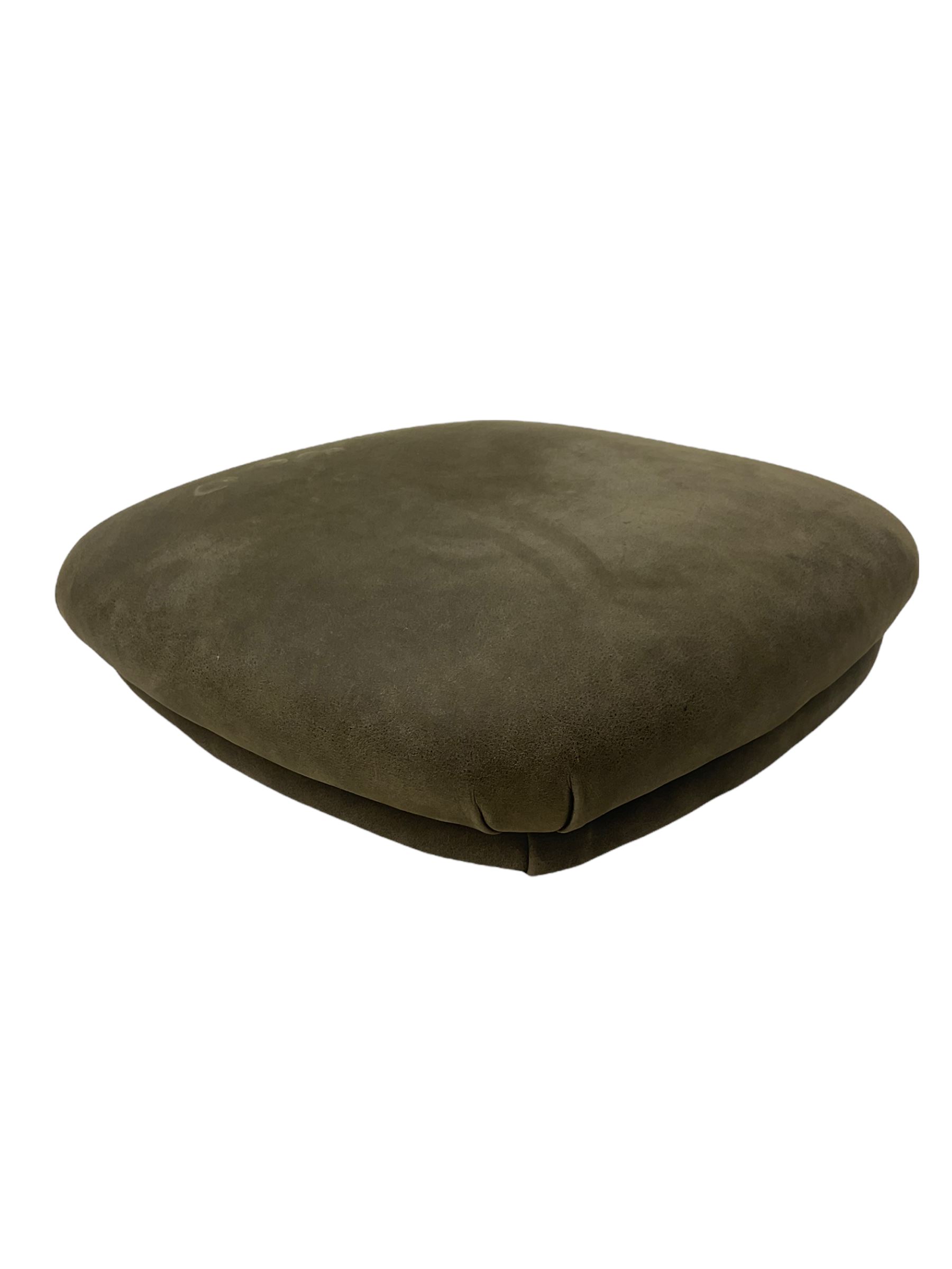 John Sankey - low armchair, buttoned back upholstered in tartan patterned fabric with contrasting grey leather, raised on turned and ebonised front feet with brass and ceramic castors, with matching foot stool