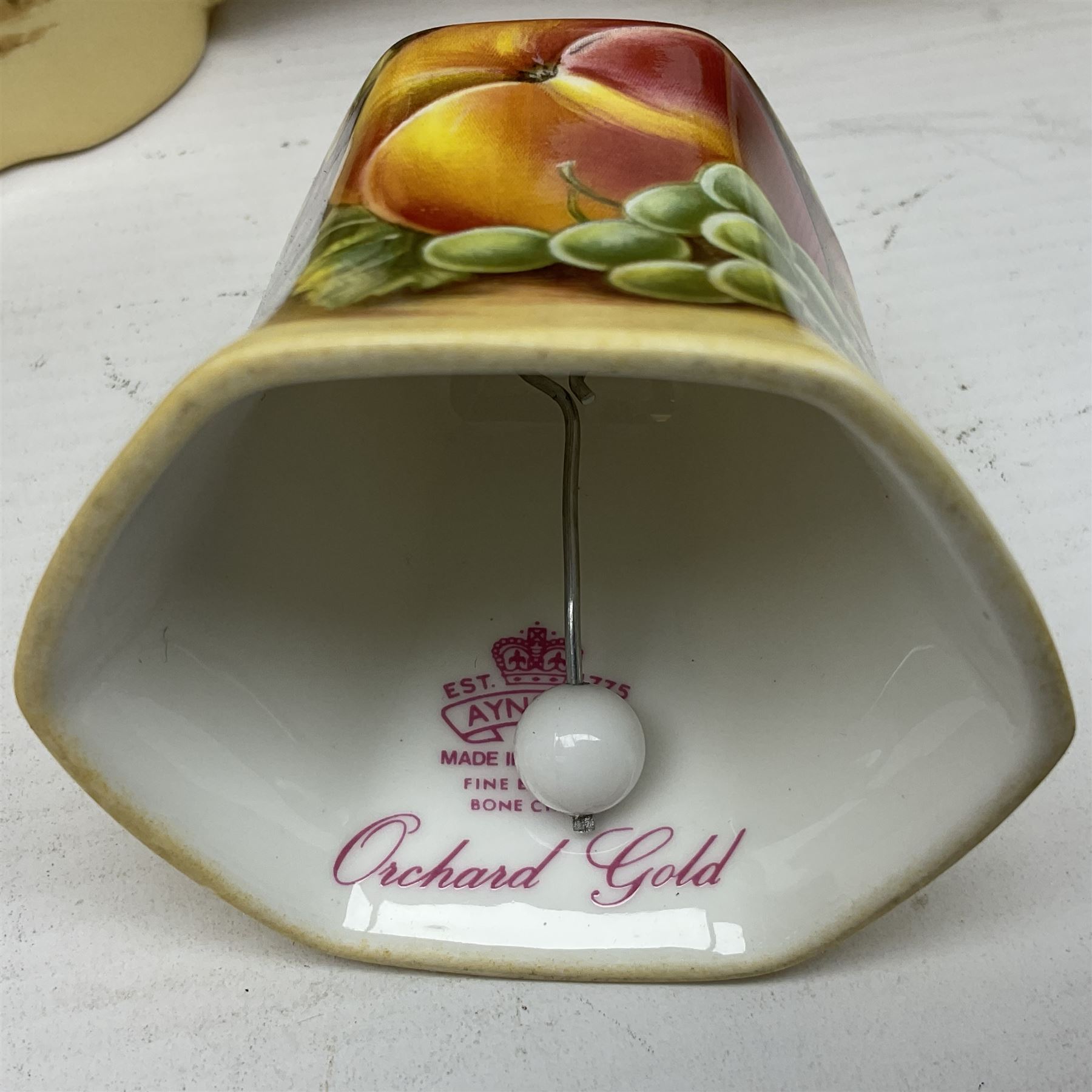 Aynsley Orchard Gold five coffee cans and saucers, mantel clock, plate etc 