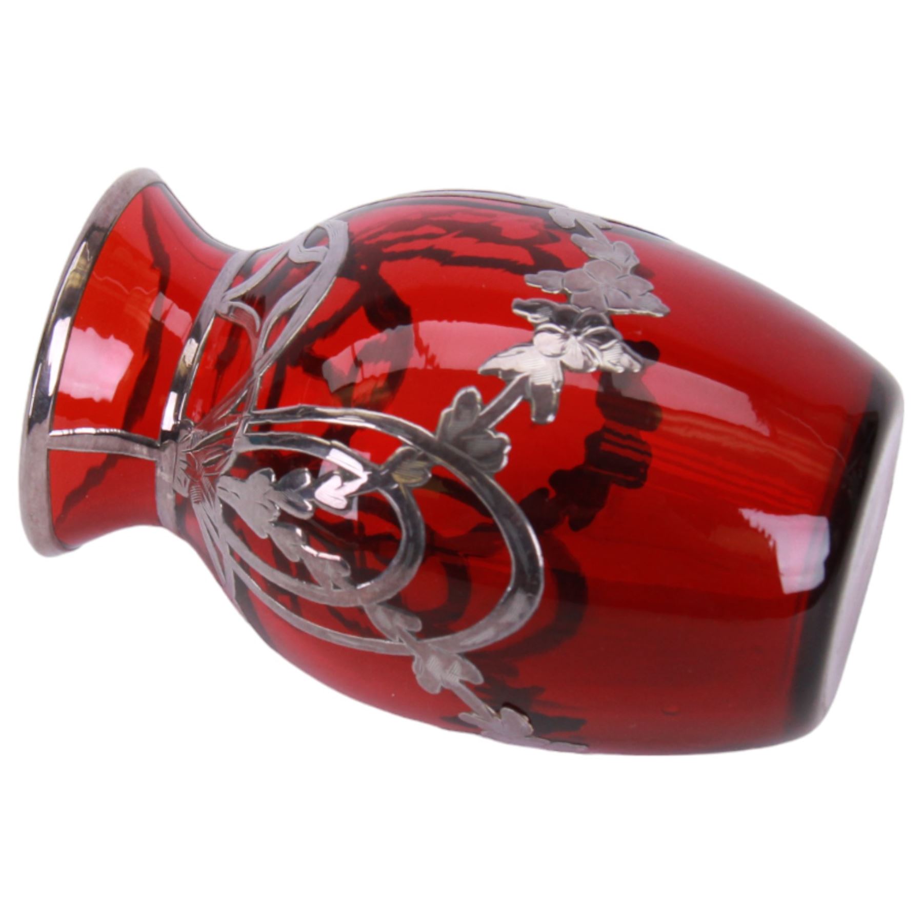 Early 20th century, ruby glass vase vase, with silver overlay of flower swags, impressed sterling H9cm, together with a similar wall vase H21cm,  