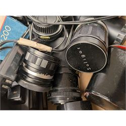 Collection of camera lenses, including Tamron, Praktica, Minolta and Soligor examples