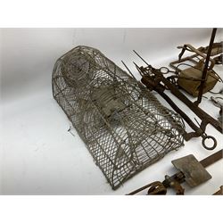 Quantity of animal traps including, gin traps, mole traps, Henri Marty wirework cage trap etc. Auctioneer's Note: These traps are sold as artefacts for ornamental purposes only as the use of some of them is illegal.