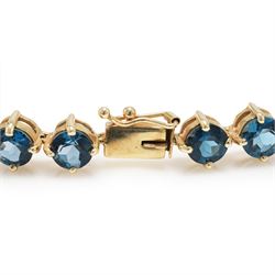 9ct gold London blue topaz bracelet, set with twenty-seven round cut topaz's, Birmingham 2006
