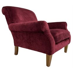 Duresta - traditional shape armchair upholstered in burgundy red velvet, on square tapering front supports (W88cm, H85cm, D103cm); together with a matching rectangular footstool with hinged seat, on turned feet with brass castors (73cm x 54cm, H38cm)