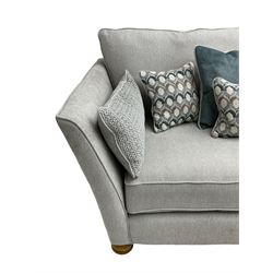 Oak Furnitureland - 'Gainsborough' lounge suite - three seat sofa, out-swept arms with loose cushions on turned oak feet, upholstered in 'Minerva Silver' fabric (W209cm D102cm H80cm); matching armchair or snuggler settee (W125cm); and rectangular ottoman footstool