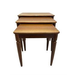 G-Plan - teak nest of three tables, rectangular top raised on turned supports