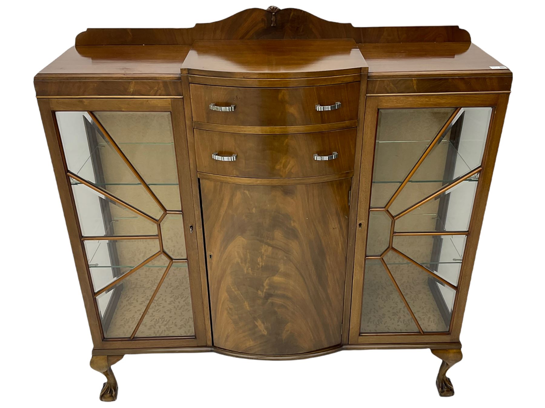 Mid-20th century Art Deco style walnut display cabinet, two central drawers over cupboard flanked by two bevel glazed display cabinets with sunburst astragal glazing, on ball and claw cabriole feet