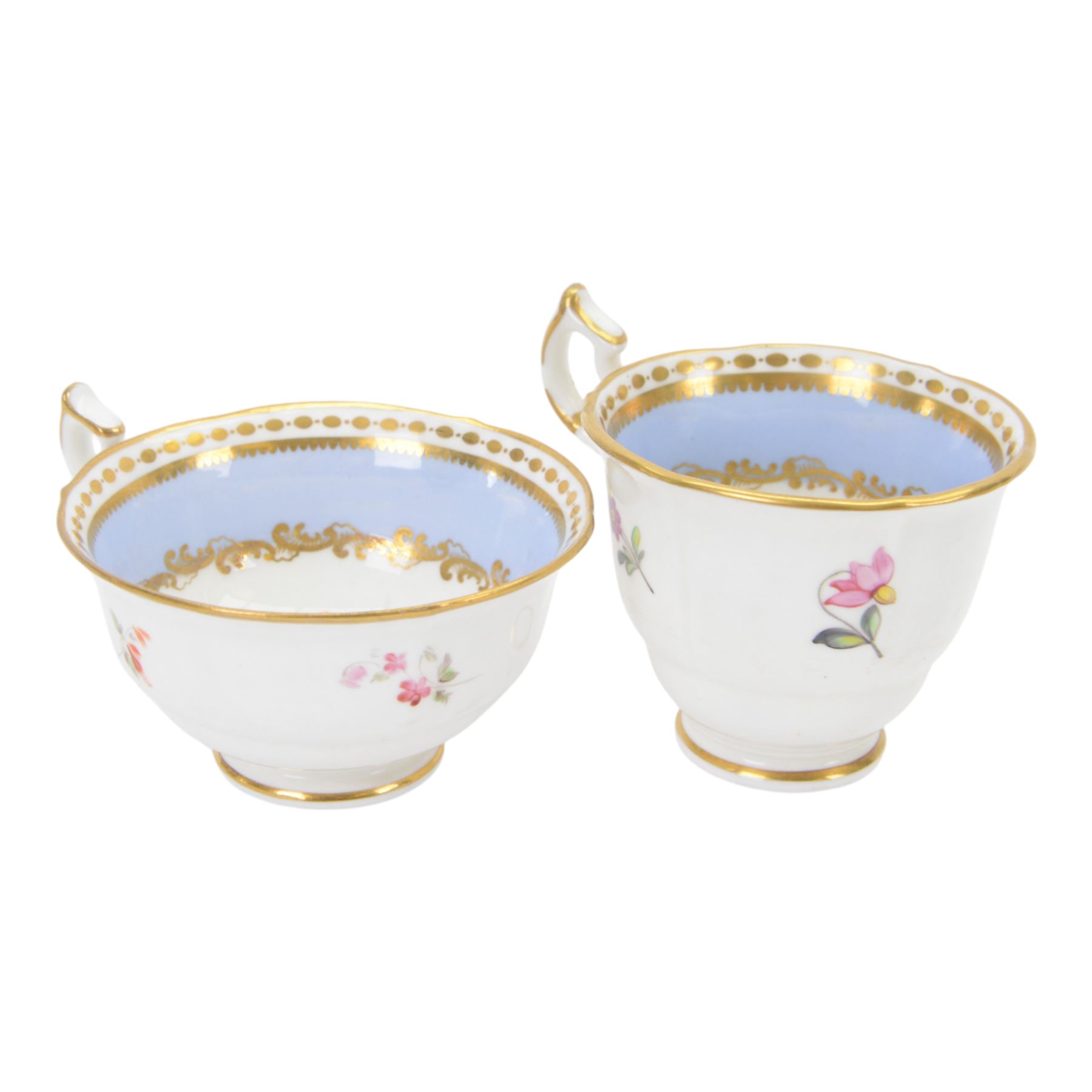 Minton trio, coffee cup, teacup and saucer, circa 1824, moulded ribbed detail, distinctive 'N' handle, painted in pattern no 139, with floral sprays and lilac blue band, coffee cup including handle H8cm, saucer D14cm, together with a Spode trio, coffee cup, teacup and saucer, circa 1830, decorated in the 3886 pattern, painted with pink cabbage roses and heightened with gilt, coffee cup including handle H8cm, saucer D15cm