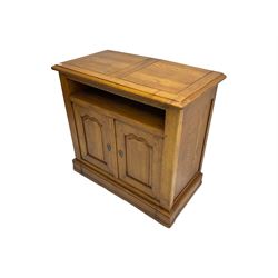 Medium oak television media cabinet, open compartment above two cupboard doors