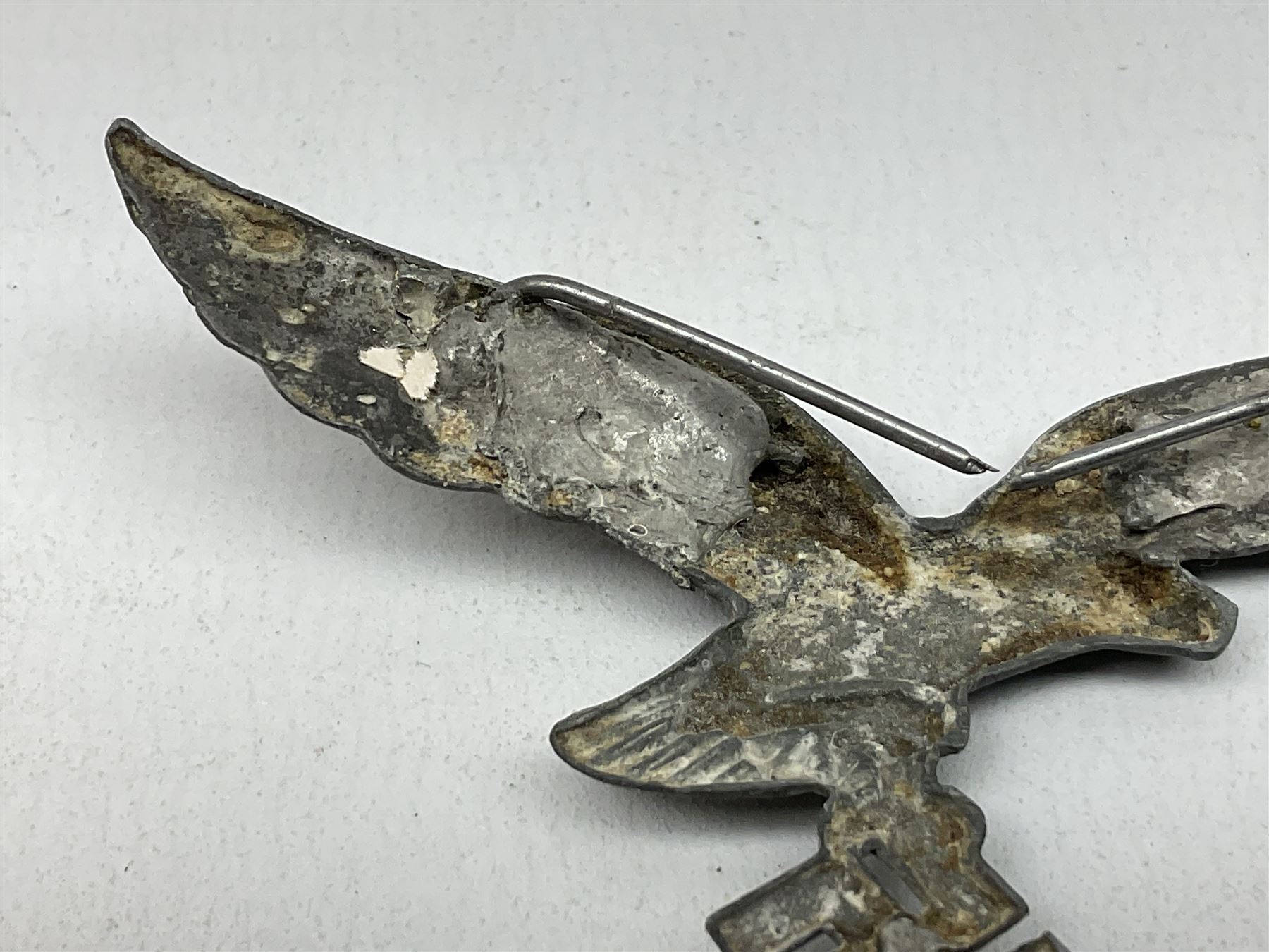 Five WW2 German peaked cap badges, four with double-pinned backs