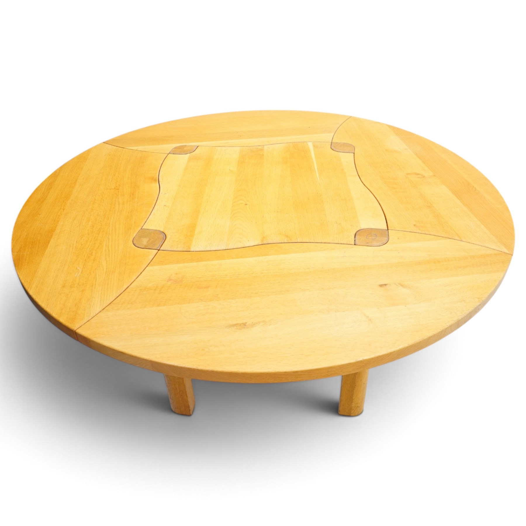 Contemporary round dining table and four orange faux leather chairs