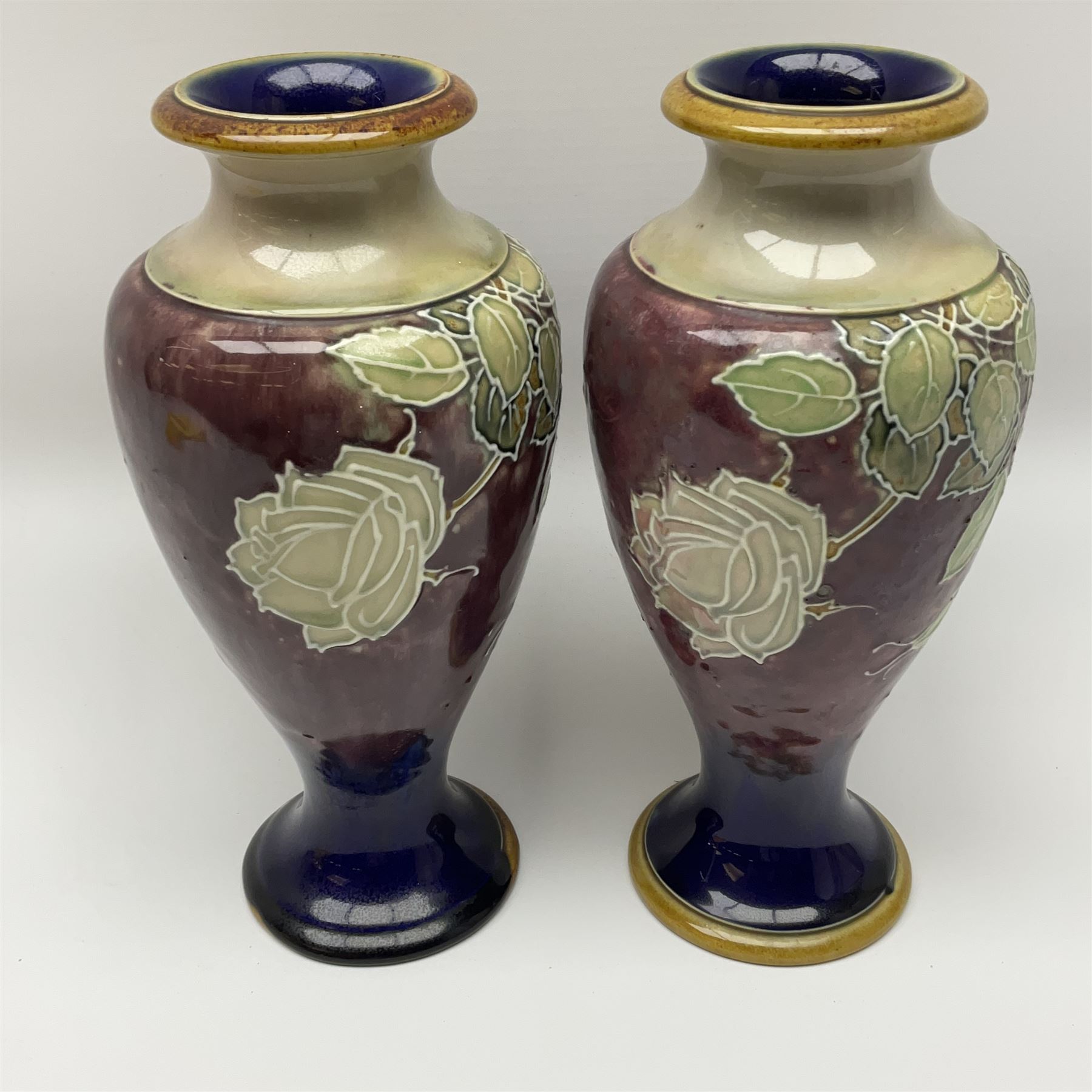 A pair of early 20th century Royal Doulton stoneware vases, of baluster