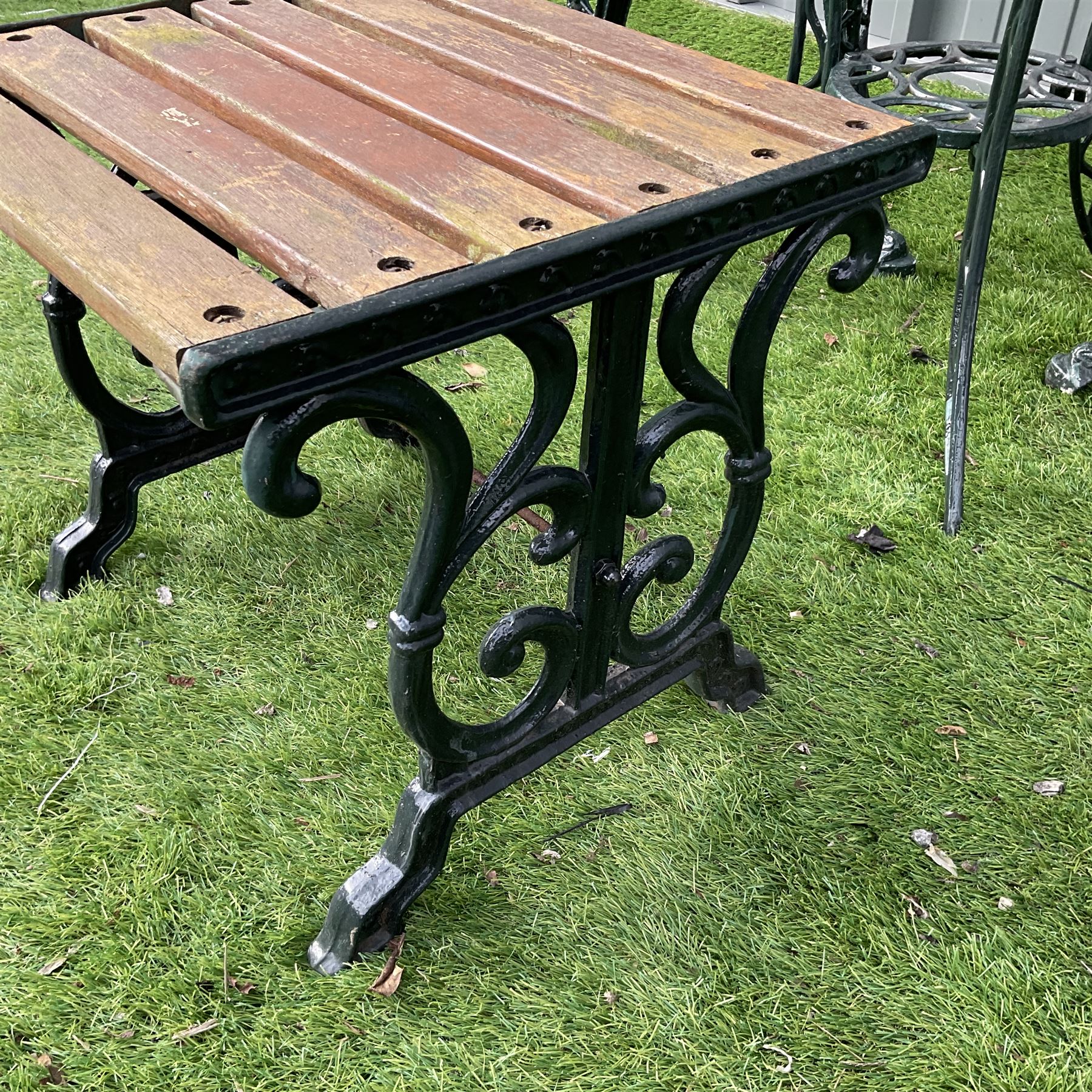 Cast aluminium garden table and two chairs with cast iron side table painted in dark green - THIS LOT IS TO BE COLLECTED BY APPOINTMENT FROM DUGGLEBY STORAGE, GREAT HILL, EASTFIELD, SCARBOROUGH, YO11 3TX