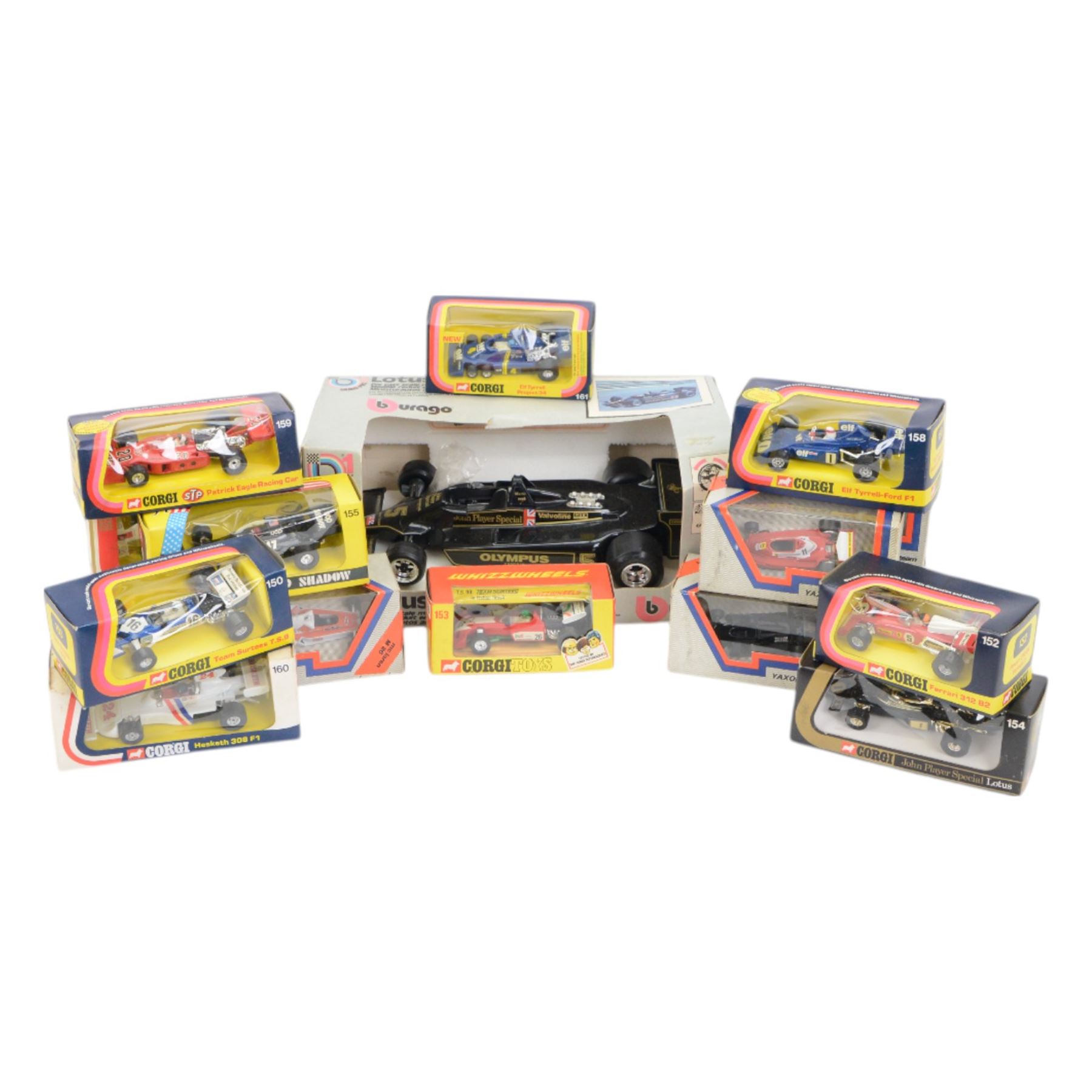 Collection of diecast Formula 1 and similar racing cars, comprising 1:14 scale Burago Lotus JPSMK4, eleven Corgi examples including 154 John Player Special Lotus, 155 Shadow and 159 Patrick Eagle Racing Car and five Yaxon Racing Team examples, all boxed