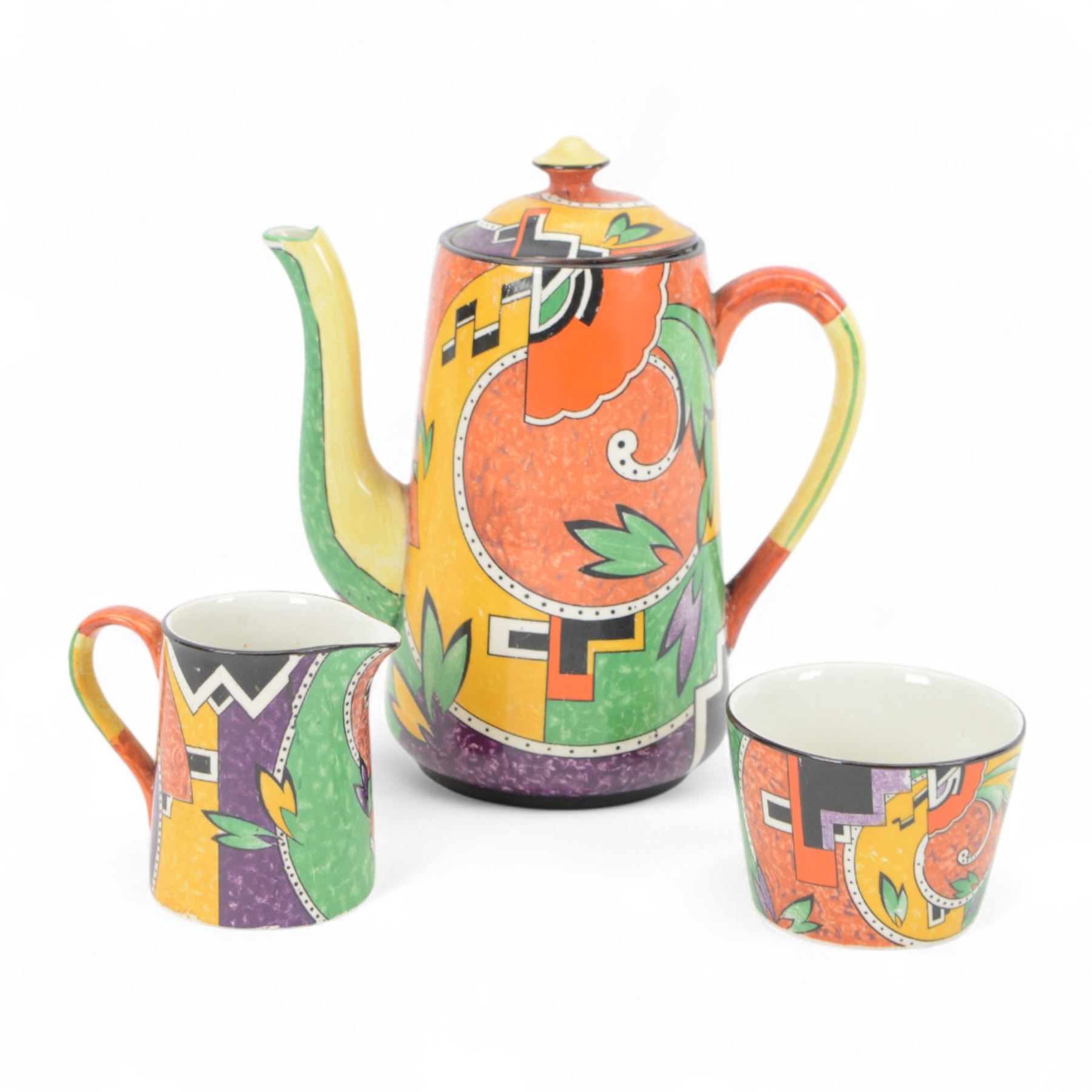 Royal Winton Jazz pattern coffee set, circa 1925, decorated with printed scroll and cubist motifs in yellow, green and red tones, comprising coffee pot, six coffee cans and saucers, cream jug and sugar bowl, coffee pot H20cm
