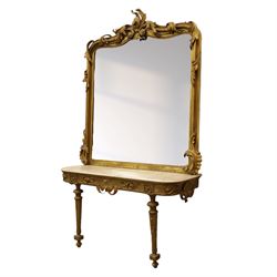 Large late 19th century Rococo revival giltwood and gesso pier mirror, the rounded rectangular frame with richly carved crest and scrolls with acanthus leaves and foliate ornamentation, above a giltwood console table with Carrara marble top and richly carved guilloche and ribbon tied laurel garland frieze, rosettes, and central scrollwork, raised upon tapered legs with beaded moulding and square block above with turned toupie style terminal  