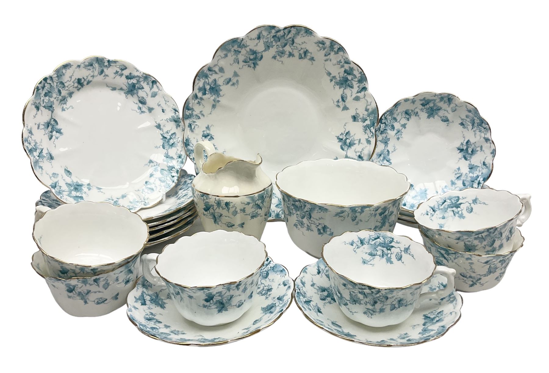 Edwardian David Chapman & Sons tea service for six, of lobed form decorated with blue transfer printed foliate decoration and gilt rims