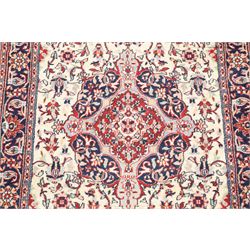 Two Persian rugs, Persian Hamadan hand-knotted rug, ivory ground centred by a terracotta medallion, surrounded by scrolling floral and foliate motifs, dark navy floral border with narrow guard stripes, fringed ends, H 176cm, W 75cm, Persian tribal hand-knotted rug, madder red ground decorated with three large geometric medallions, surrounded by angular motifs, enclosed by multiple geometric borders in dark navy, ivory and red, fringed ends, H 150cm, W 91cm