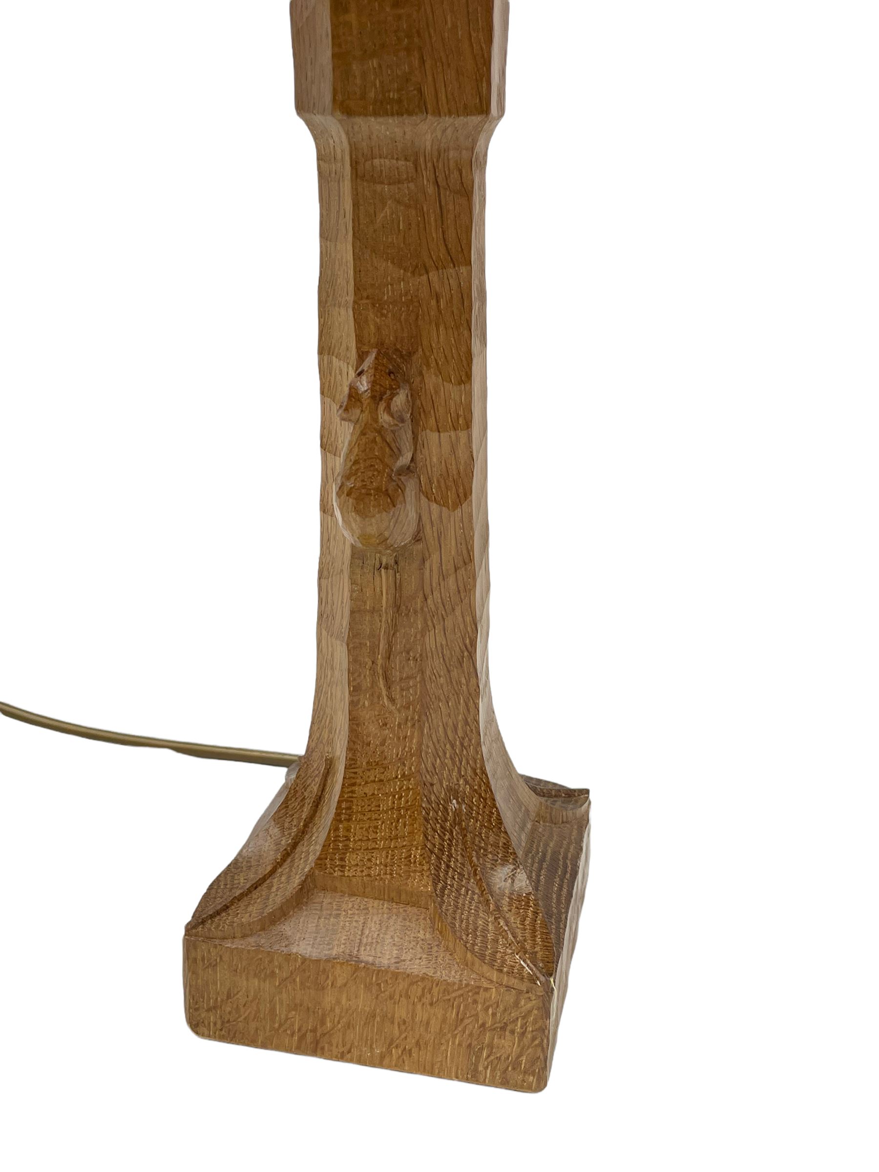 'Mouseman' tooled oak table lamp, the octagonal tapered stem carved with mouse signature, with shade, by Robert Thompson of Kilburn