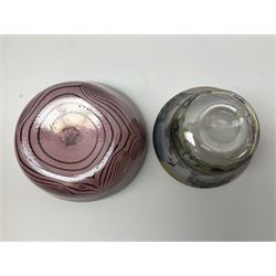 Two Eisch studio glass bowls, the first example hand painted with a landscape of trees, the second example decorated with black spirals upon a pink ground, each marked beneath, tallest example H7cm