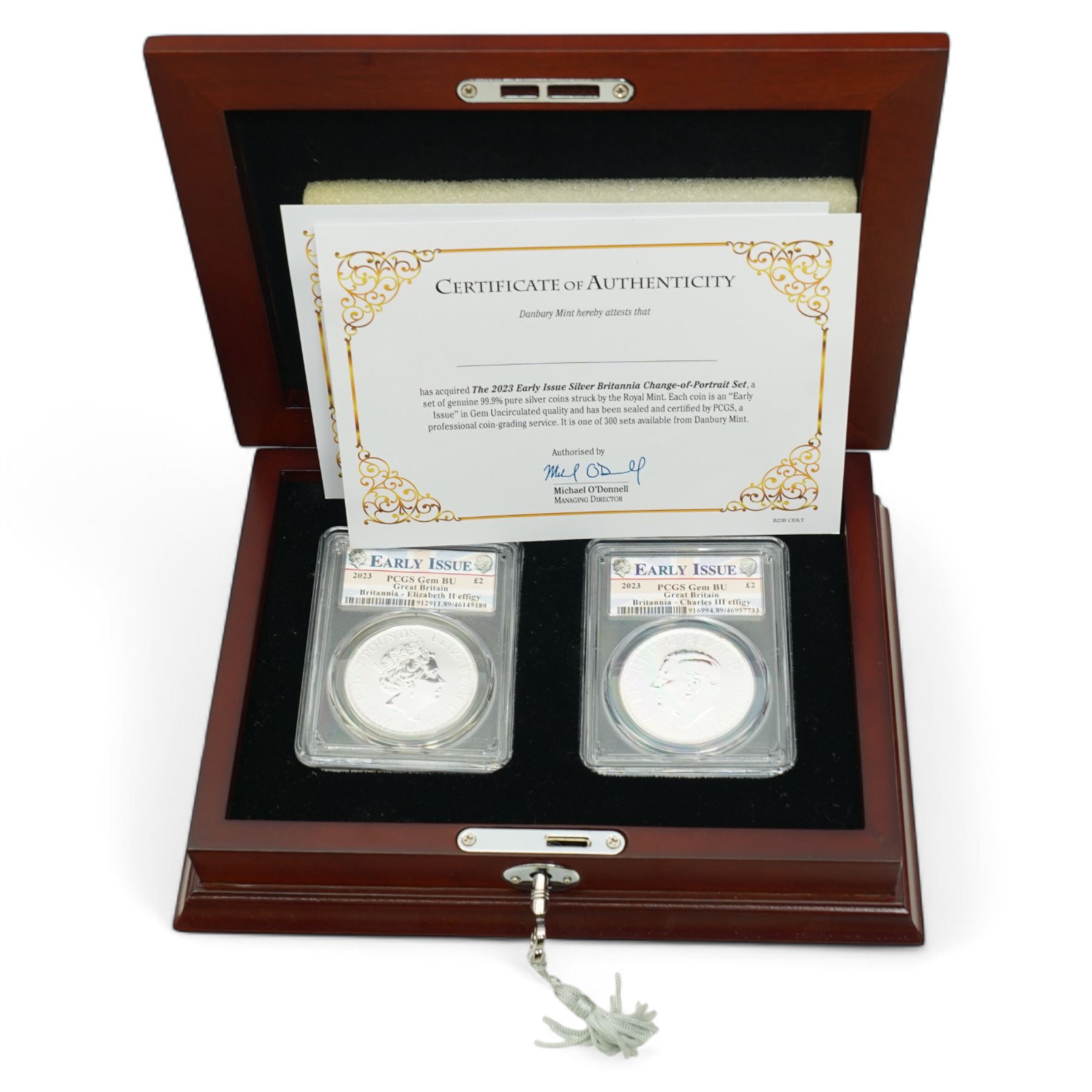 Queen Elizabeth II 'Silver Jubilee' hallmarked sterling silver commemorative stamp ingot, Channel Islands 2002 'The Duke of Wellington' silver three coin set, 2006 'The Queen's Eightieth Birthday Silver Lenticular Medal', Isle of Man 2021 'Silver Proof Sovereign', Danbury Mint 'The 2023 Early Issue Silver Britannia Change-of-Portrait Set', all cased with certificates and a facsimile newspaper etc