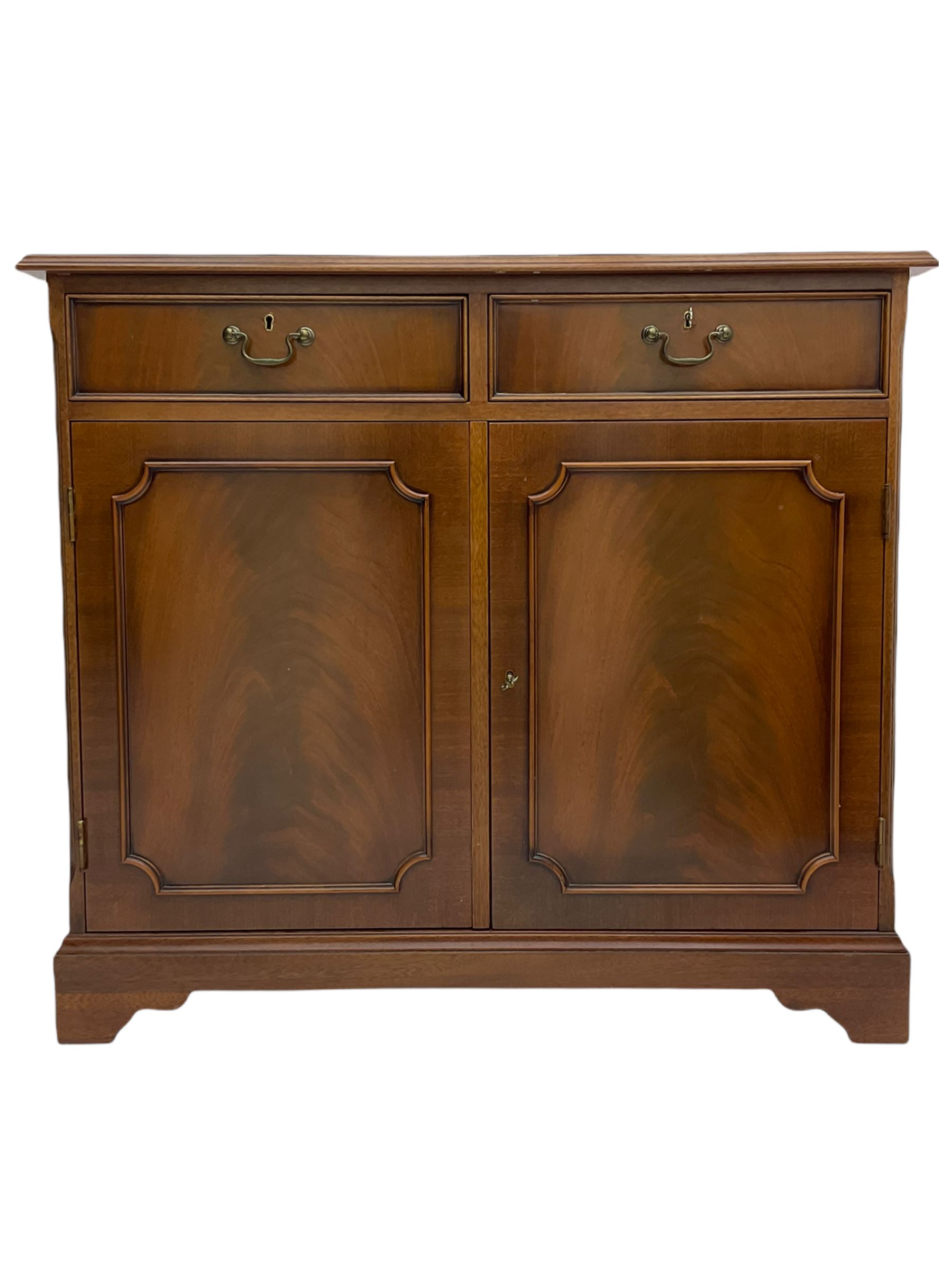 Reproduction mahogany side cabinet, moulded rectangular top over two drawers and double cupboard, bracket feet