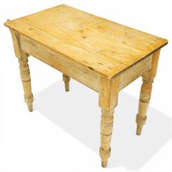 Victorian stripped pine table fitted with two drawers, supported on turned supports