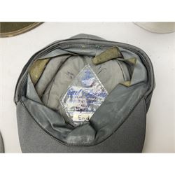 Five reproduction German WW2 hats comprising Wehrmacht olive tropical helmet, Heer officer's peaked cap, two M43 caps and Field side cap (5)