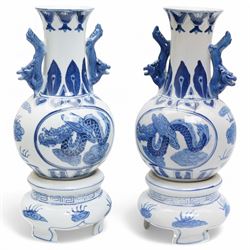 Pair of Chinese blue and white vases and stands, of baluster form with elongated neck, dec...