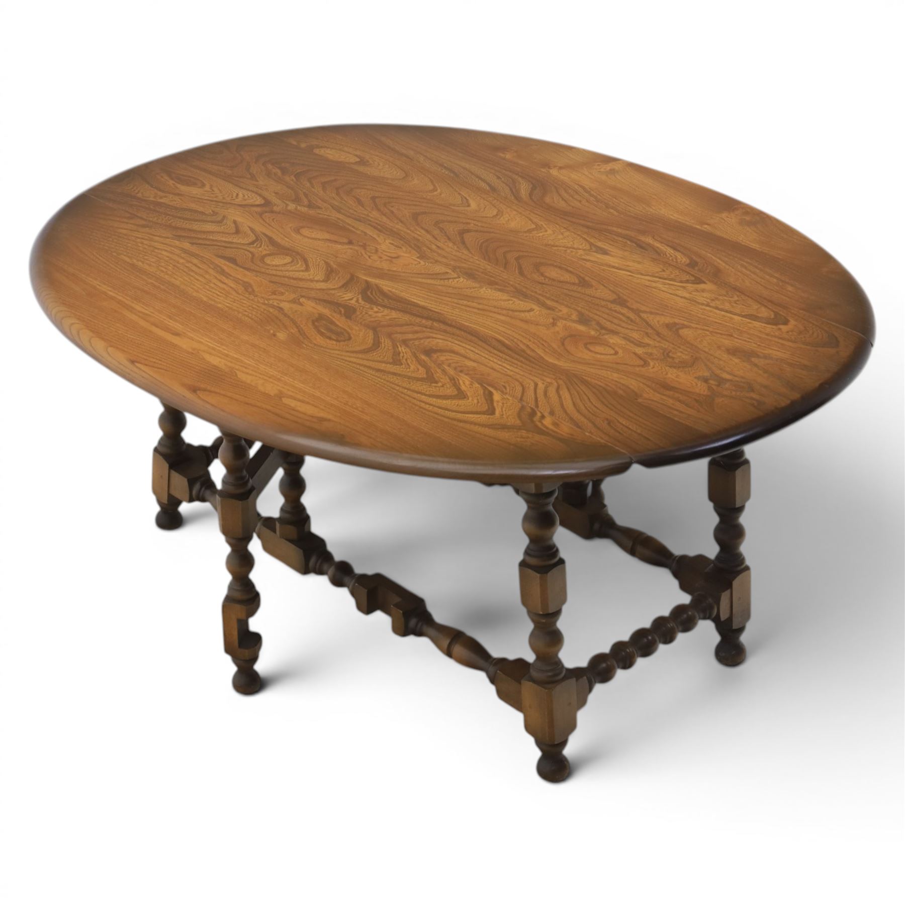 Ercol - elm oval/rectangular drop leaf coffee table, bobbin turned base