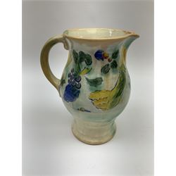 Early 20th century Royal Doulton Brangwyn Ware jug and set of six beakers, designed by Frank Brangwyn RA, all decorated in the Harvest pattern with stylised leaves and fruit on mottled peach and green ground, all with printed marks beneath, date code for 1920s, largest H18cm