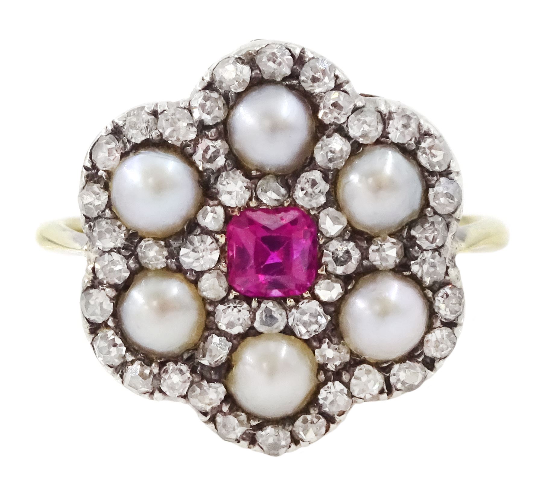 Early 20th century 18ct gold and silver ruby, diamond and pearl flower head cluster ring, single octagonal cut ruby of approx 0.30 carat, with old cut and rose cut diamond and split pearl surround