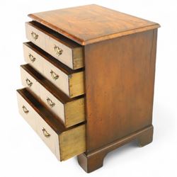 Small 19th century figured walnut chest of drawers, rectangular top with moulded edge over four graduating drawers with brass batwing handles, raised on bracket feet