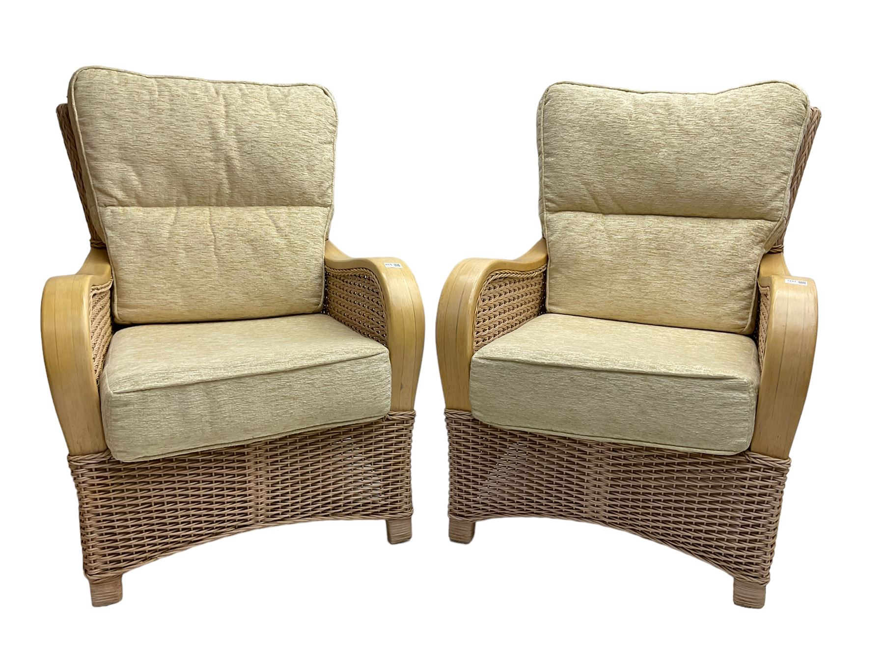 Contemporary rattan conservatory suite - two seat sofa with wicker frame and loose cushions upholstered in textured champagne fabric (W125cm H98cm); pair of matching armchairs (W72cm H98cm); rectangular glass-topped coffee table with rattan frame and undertier (W85cm D60cm H47cm); and matching square side table (W53cm H55cm)