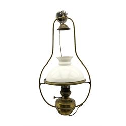 Early 20th century brass oil lamp with opaque glass shade, later converted to electric, H80cm 