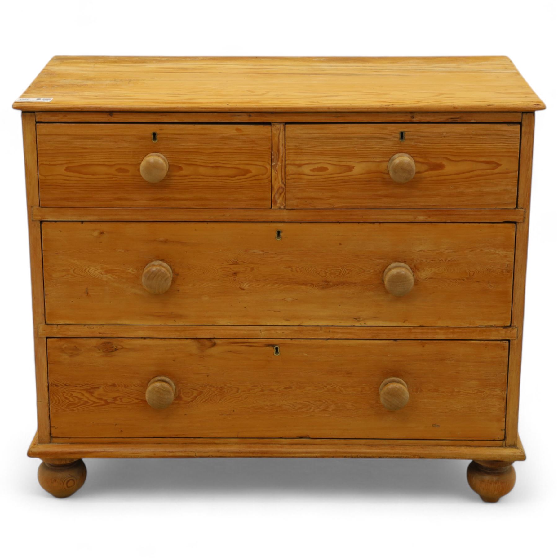 Victorian stripped pine chest, rectangular top over two short and two long drawers with turned wooden knob handles, on bun feet