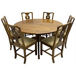 David Shackleton of Snainton - circular figured elm dining table, turned pedestal column on three splayed supports; together with a set of eight dining chairs, shaped cresting rail over shaped and pierced splat, upholstered drop in seat, on square supports united by stretchers 