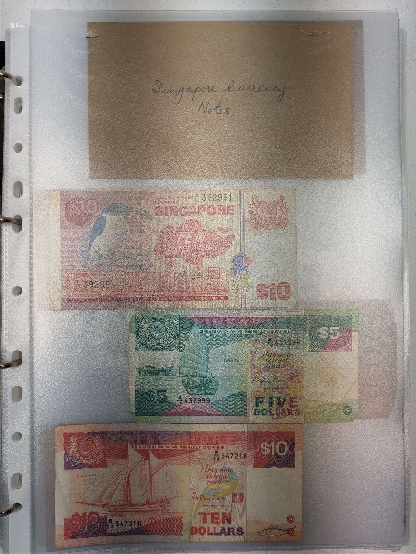 Great British and World banknotes, including two Bank of England Gill five pounds 'SA79432020' and 'SA79432021' various Somerset one pounds etc, Reserve Bank of New Zealand fifty dollars, various The States of Jersey one pounds, Singapore ten dollars etc, housed in a ring binder folder