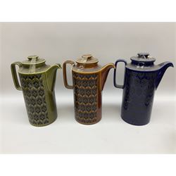 Hornsea pottery tea wares and kitchenalia, to include saffron pattern spice pots in a wooden rack, coral pattern coffee pot and milk jug, pennine pattern tea and coffee storage jars, three heirloom pattern coffee pots in blue, green and brown, etc